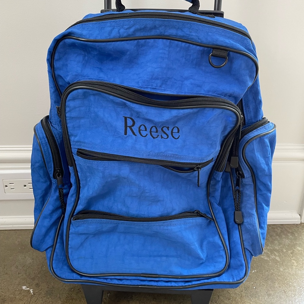Lillian Vernon kids blue rolling luggage overnight bag personalized Reese